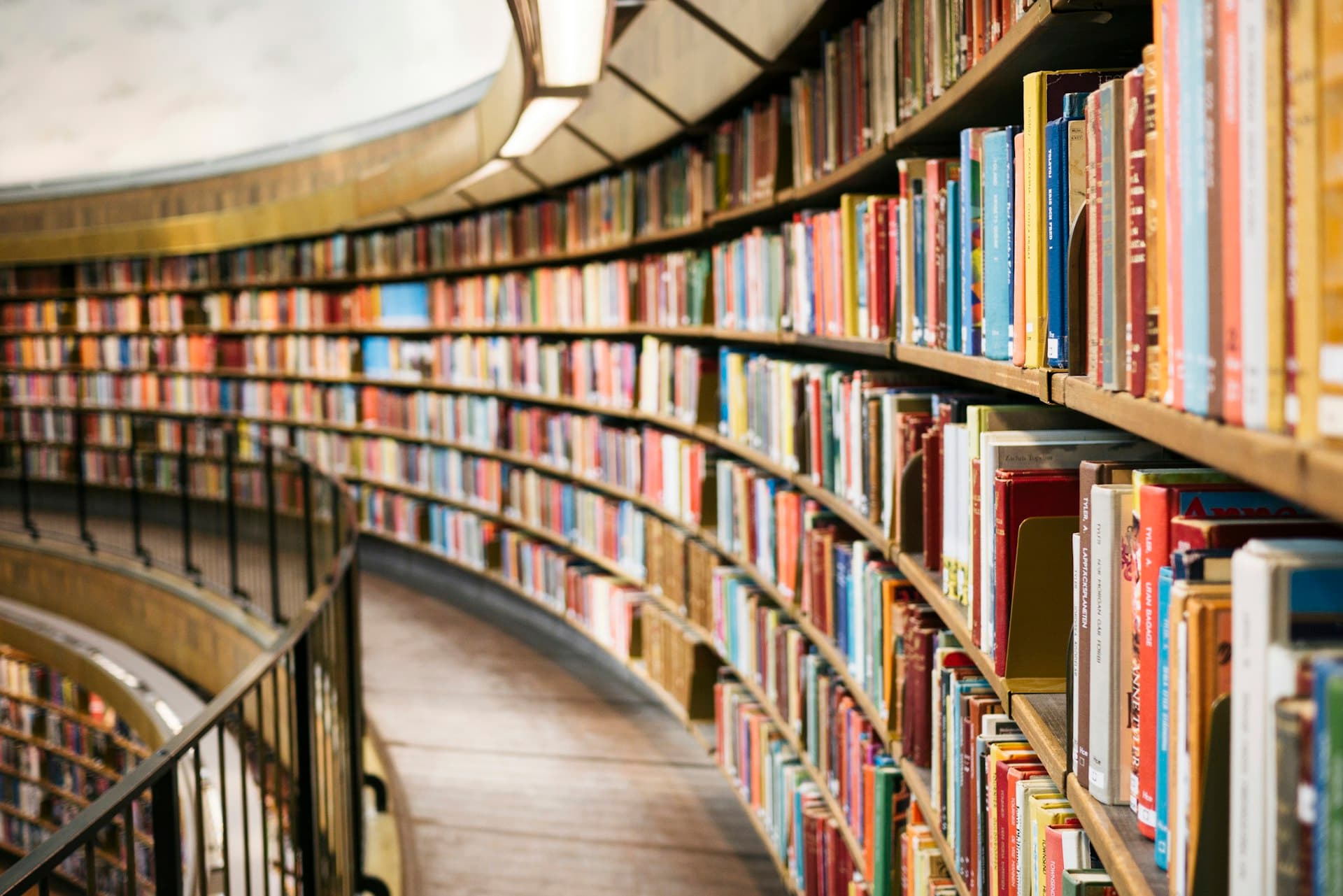 Curved shelves of a reading library lined with books
